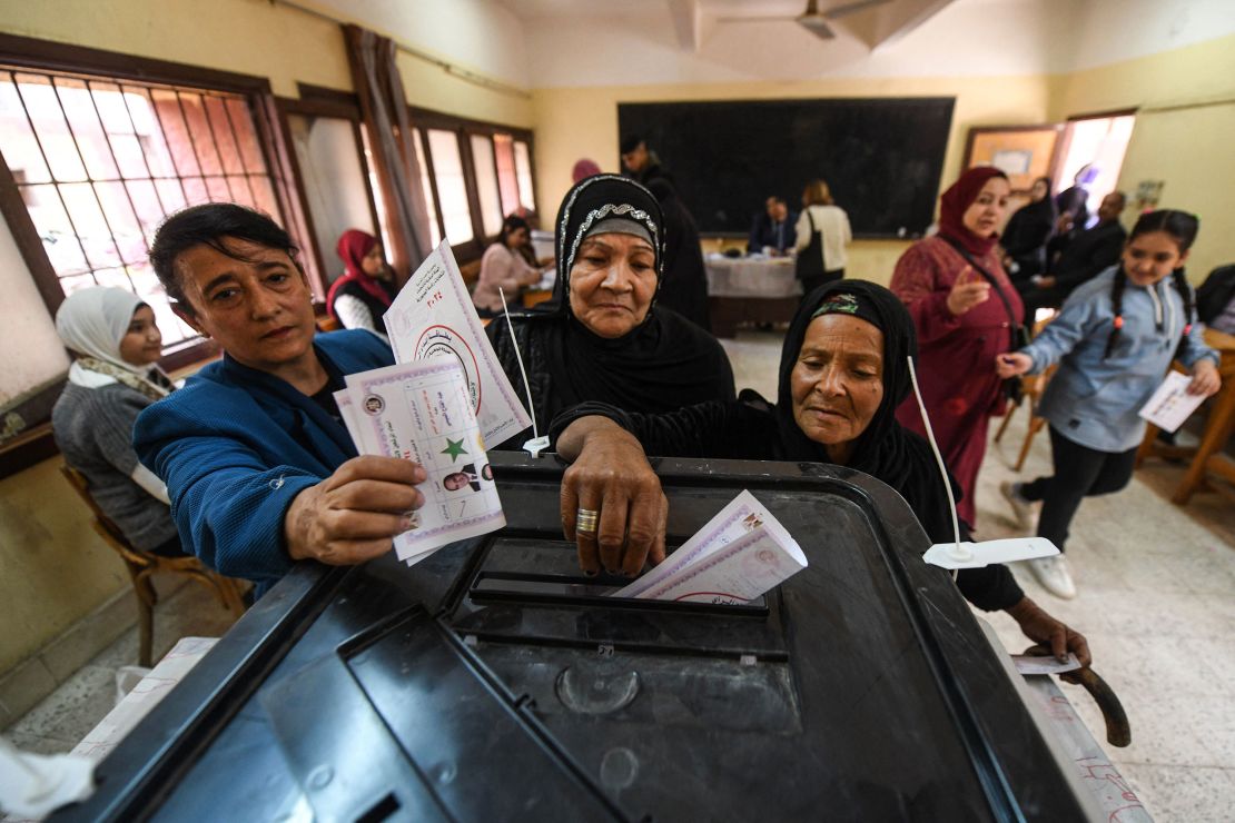 Egyptian women cast their ballot at a polling station of Shubra Secondary school in the presidential election in Cairo on December 10, 2023. The vote in the country of nearly 106 million people will run until December 12, with results expected to be announced on December 18. (Photo by Ahmed HASAN / AFP) (Photo by AHMED HASAN/AFP via Getty Images)