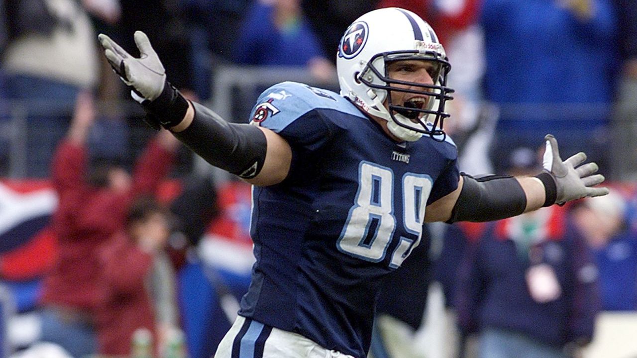 Frank Wycheck of the Tennessee Titans celebrates after throwing a lateral to Kevin Dyson on a kick-off return for a touchdown during the second half of the AFC Wild Card Game against the Buffalo Bills 08 January 2000, at Adelphia Coliseum in Nashville, Tennessee. The Titans won the game 22-16 to advance to the next round of the NFL playoffs.