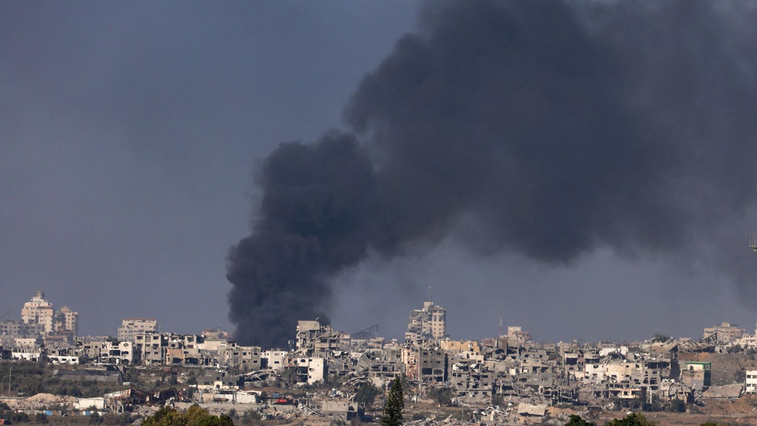 A picture taken in southern Israel near the border with the Gaza Strip on December 11, 2023, shows smoke billowing during Israeli bombardment on northern Gaza, amid continuing battles between Israel and the militant group Hamas. (Photo by Menahem KAHANA / AFP) (Photo by MENAHEM KAHANA/AFP via Getty Images)