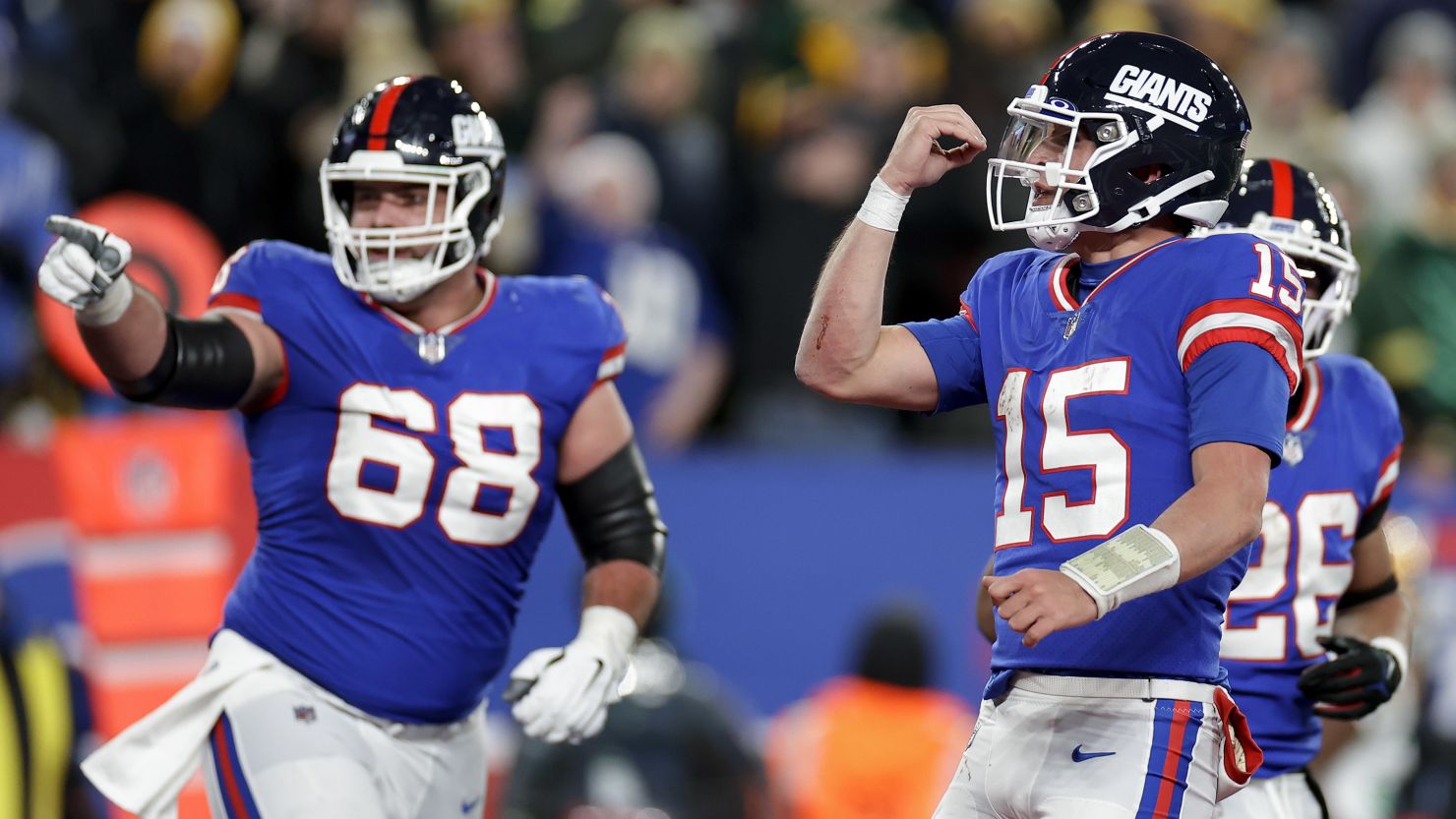 New York Giants quarterback Tommy DeVito (15) and guard Ben Bredeson (68) celebrate after a touchdown against the Green Bay Packers during the third quarter of an NFL football game, Monday, Dec. 11, 2023, in East Rutherford, N.J. (AP Photo/Adam Hunger)
