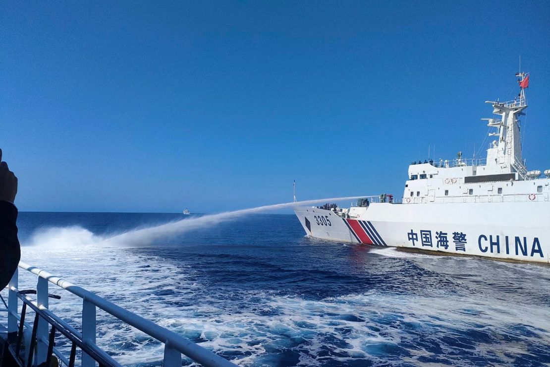 In this photo provided by the Philippine Coast Guard, a Chinese Coast Guard ship, right, uses its water cannons on a Philippine Bureau of Fisheries and Aquatic Resources (BFAR) vessel as it approaches Scarborough Shoal in the disputed South China Sea on Saturday December 9, 2023.