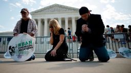 WASHINGTON, DC - APRIL 21: (L-R) Rev. Pat Mahoney, Peggy Nienaber of Faith and Liberty and Mark Lee Dickson of Right to Life East Texas pray in front of the U.S. Supreme Court on April 21, 2023 in Washington, DC. Organized by The Stanton Public Policy Center/Purple Sash Revolution, the small group of demonstrators called on the Supreme Court to affirm Federal District Court Judge Matthew Kacsmaryk's ruling that suspends the Food and Drug Administration's approval of the abortion pill mifepristone. (Photo by Chip Somodevilla/Getty Images)