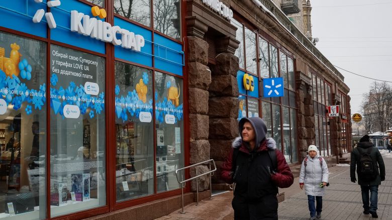 People walk past a store of Ukraine's telecommunications company Kyivstar, amid Russia's attack on Ukraine, in Kyiv, Ukraine December 12, 2023. REUTERS/Alina Smutko