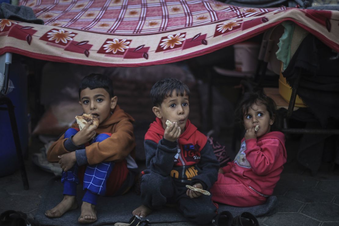 Palestinian children take shelter at a school run by the United Nations Relief and Works Agency for Palestine Refugees in the Near East (UNRWA), in the city of Khan Yunis, in southern Gazan. 