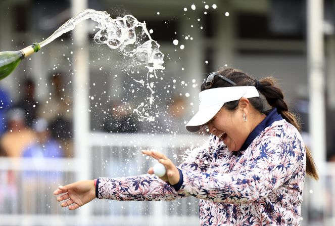 Vu's dressing gown was the consequence of a celebratory leap into the lake beside the 18th green, but her floral playing outfit was a standout in itself as Vu clinched her first major title in style.