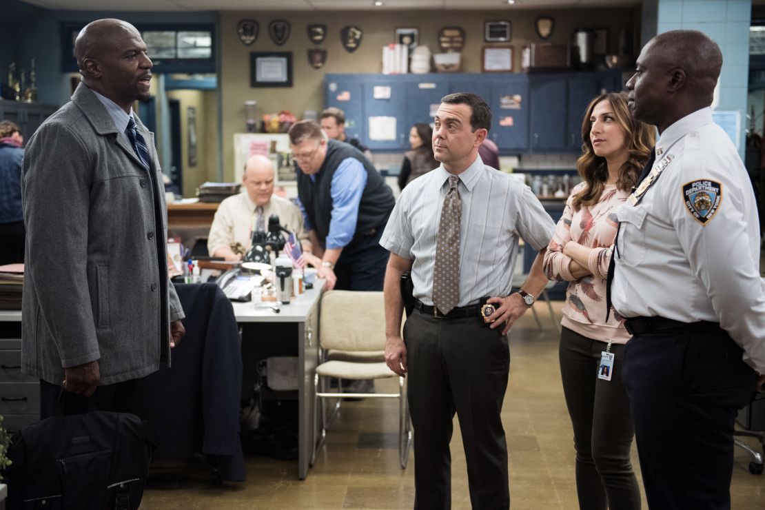 BROOKLYN NINE-NINE -- "Det. Dave Majors" Episode 221 -- Pictured: (l-r) Terry Crews as Terry Jeffords, Joe Lo Truglio as Charles Boyle, Chelsea Peretti as Gina, Andre Braugher as Ray Holt-- (Photo by: Eddy Chen/NBCU Photo Bank/NBCUniversal via Getty Images via Getty Images)