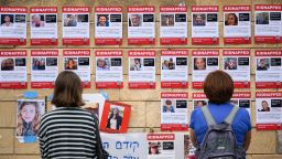 People look at photographs of some of those taken hostage by Hamas in Tel Aviv, Israel, on October 18.