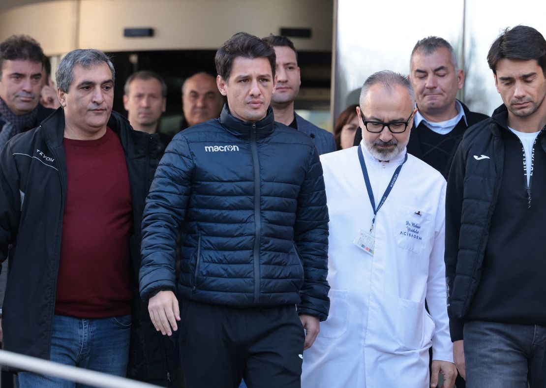 Turkish referee Halil Umut Meler, accompanied by head doctor Mehmet Yorubulut, leaves from a hospital in Ankara, Turkey December 13, 2023. REUTERS/Cagla Gurdogan