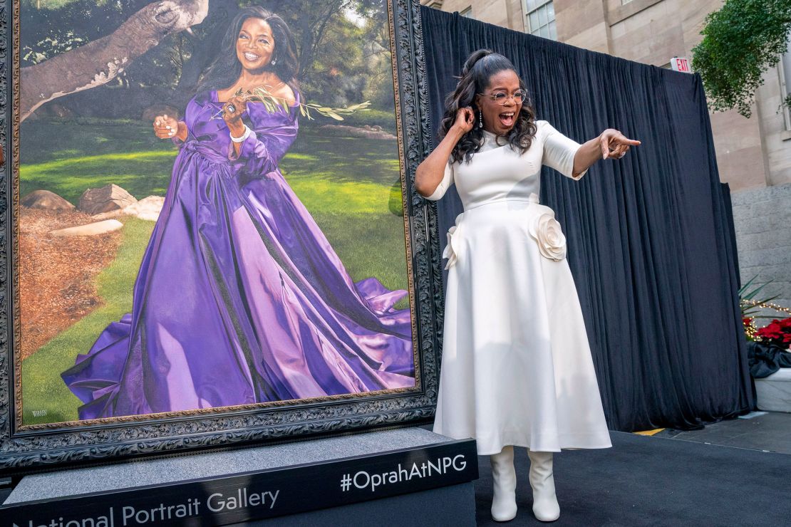 Oprah Winfrey shouts out to a member of the crowd while next to her portrait, Wednesday, Dec. 13, 2023, during a portrait unveiling ceremony at the Smithsonian's National Portrait Gallery in Washington. (AP Photo/Jacquelyn Martin)