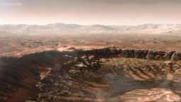 This animated artist's concept depicts a scene of water breaking through the rim of Mars' Jezero Crater, which NASA's Perseverance rover is now exploring.