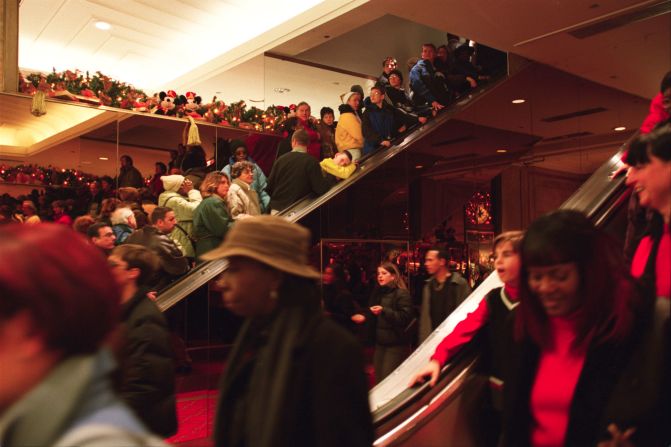 Shoppers crowd a Macy's after the Thanksgiving holiday in 2000.