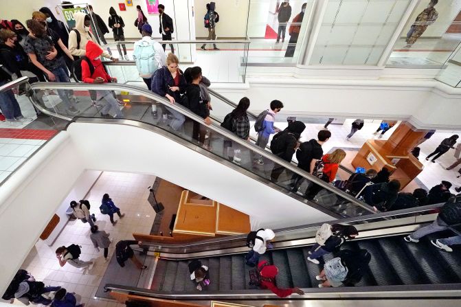 Students from Downtown Burlington High School use an escalator at a former Macy's that was converted into a school in Burlington, Vermont, in 2021. The Macy's had closed in 2018, <a href="https://www.usatoday.com/story/news/education/2021/03/31/vermont-macys-turned-high-school-what-downtown-burlington-looks-like/4818514001/" target="_blank" target="_blank">but it found a new purpose</a> after the students' school was closed due to toxic chemicals.