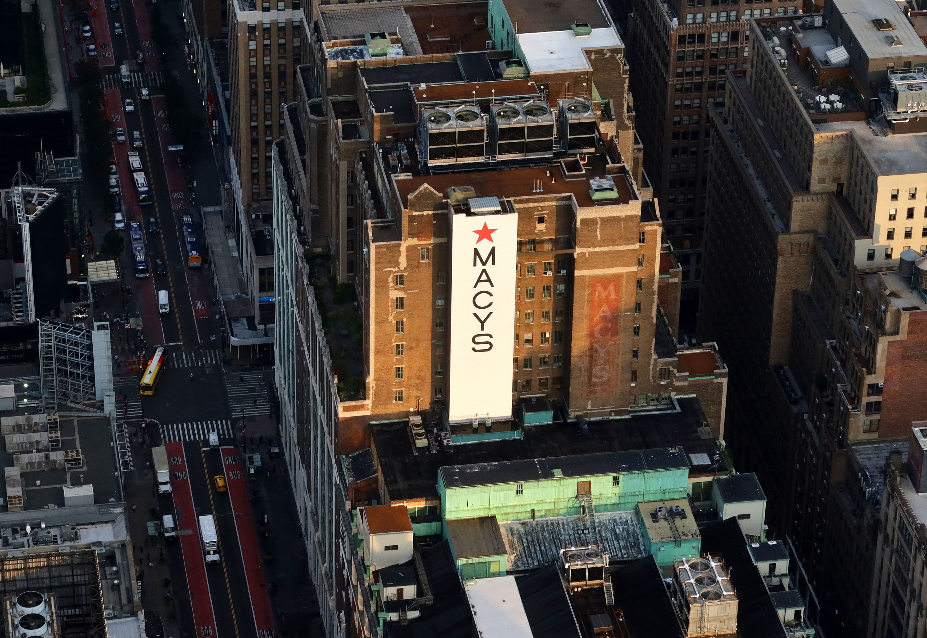 The rising sun illuminates the flagship Macy's in New York in 2023.