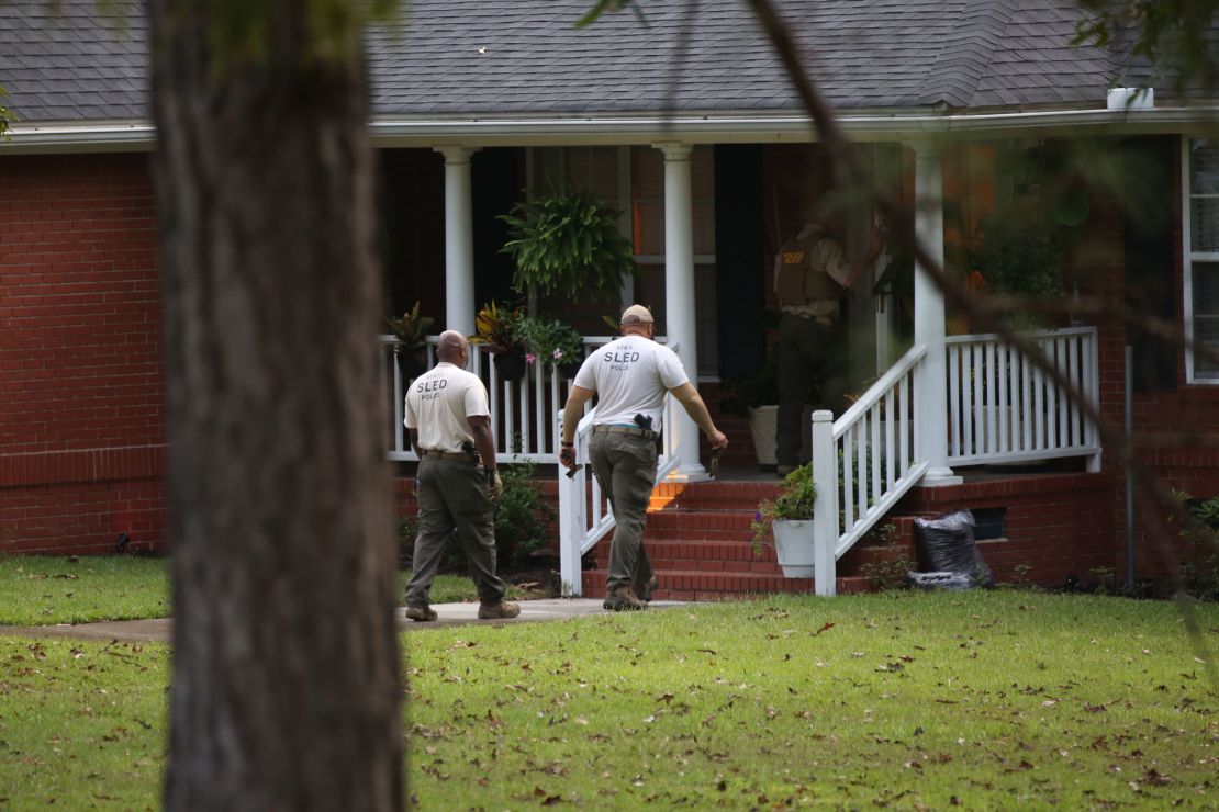 SLED officers enter a home following a law enforcement raid related to suspected dog fighting in Orangeburg, South Carolina, on September 21, 2023.