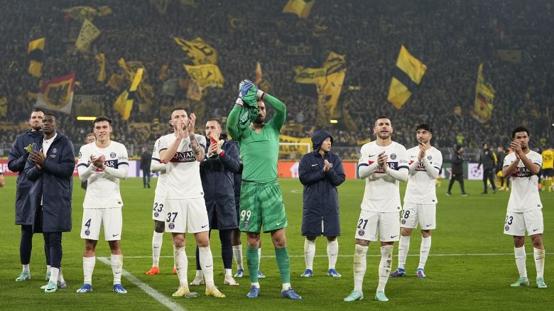 PSG's team players applaud after the Champions League Group F soccer match between Borussia Dortmund and Paris Saint-Germain at the Signal Iduna Park in Dortmund, Germany, Wednesday, Dec. 13, 2023. (AP Photo/Martin Meissner)