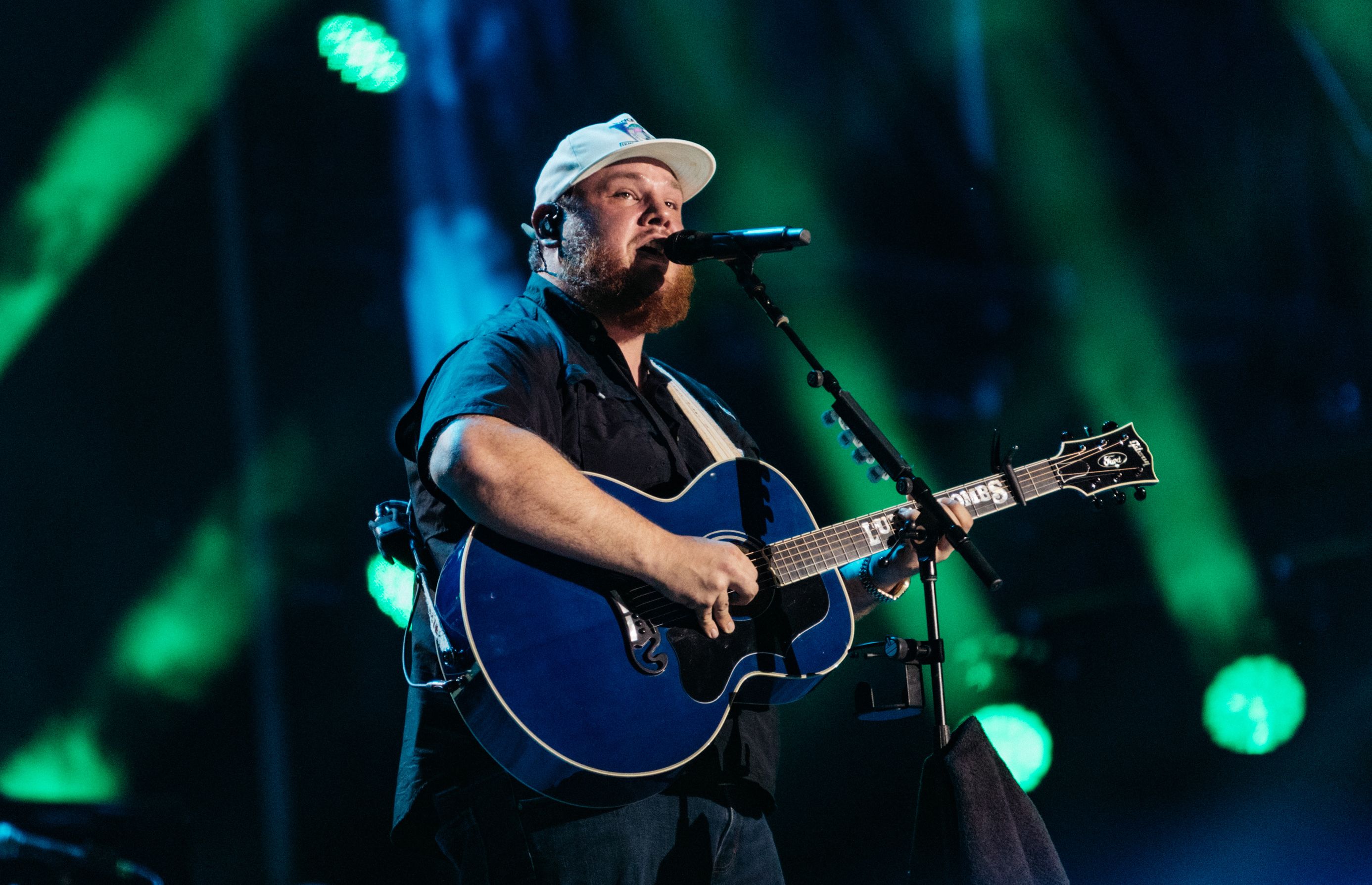 Luke Combs apologizes to woman hit with costly legal bill for selling