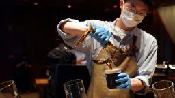 A coffee maker pours coffee to a take-out paper cup at the Starbucks Reserve Roastery in Shanghai, east China, June 3, 2022.