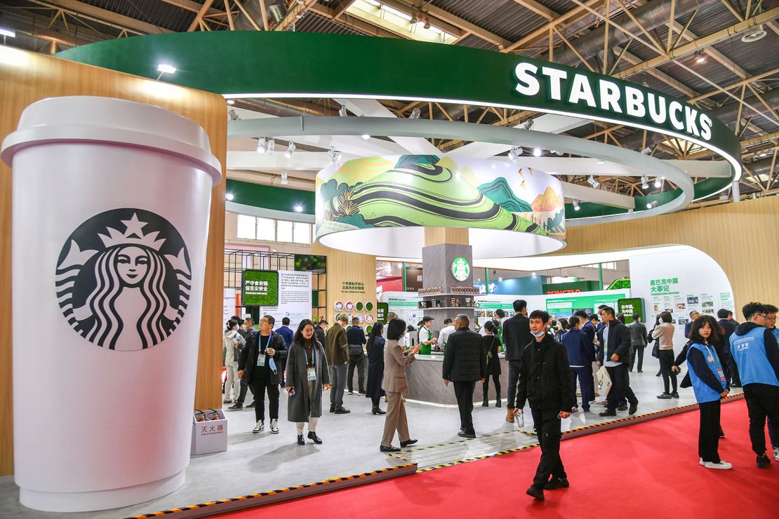 People visit Starbucks booth during the first China International Supply Chain Expo (CISCE) at China International Exhibition Center (Shunyi Venue) on November 28, 2023 in Beijing, China.