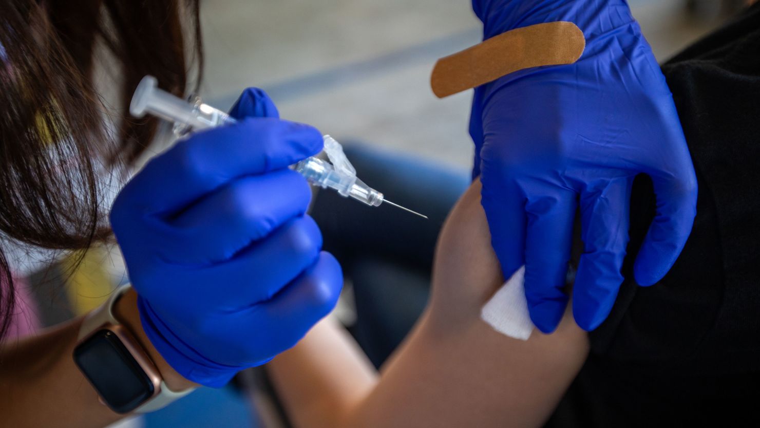 Allissa Sanchez, LVN, gives her patient a vaccine during a flu and COVID-19 vaccination clinic at Kaiser Permanente Pasadena on Thursday, Oct. 12, 2023, in Pasadena, CA.