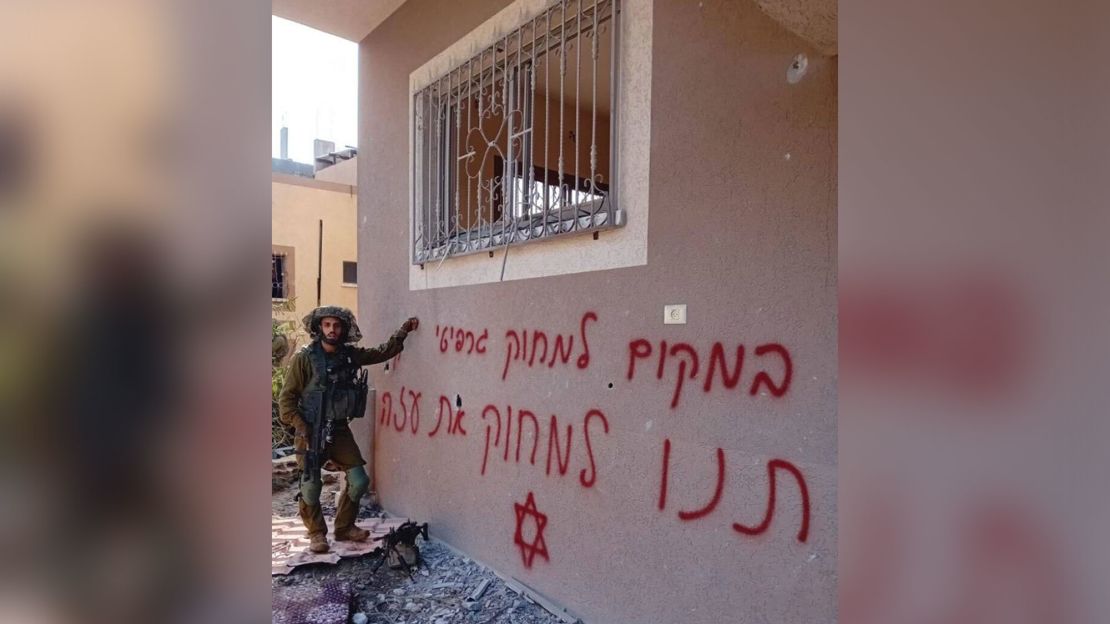 An image shared online shows an Israeli soldier next to a sign that says "Instead of erasing graffiti, let us erase Gaza."