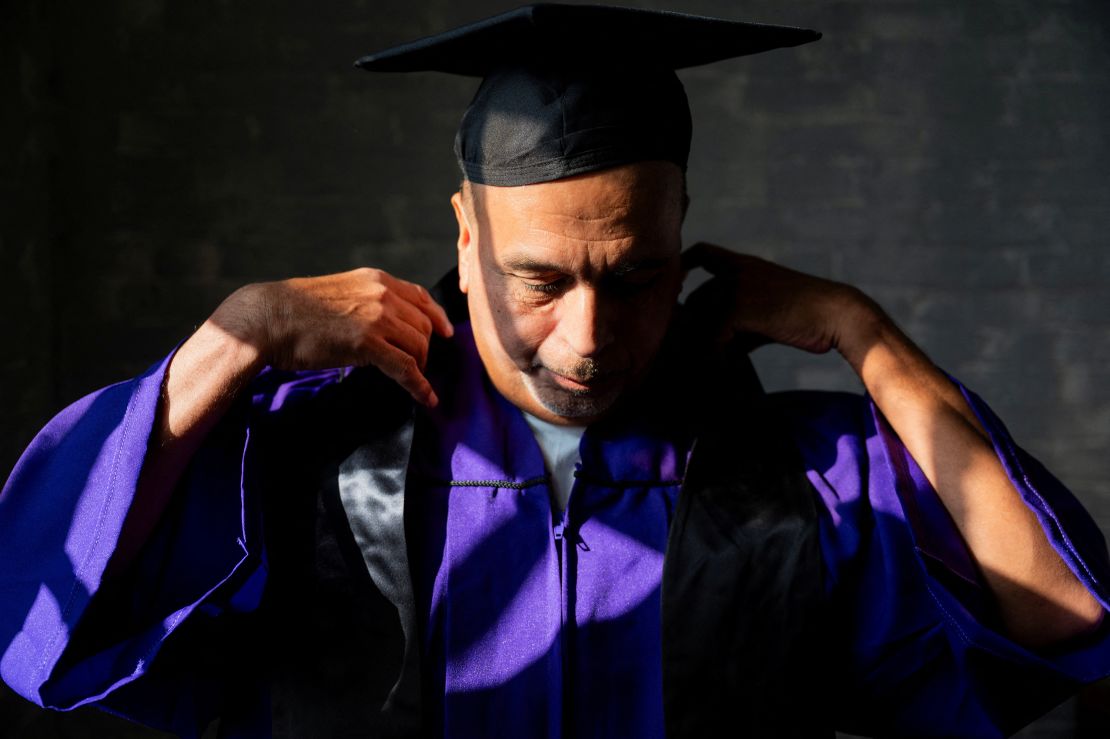 James Soto adjusts his regalia during a November graduation ceremony for students of the Northwestern Prison Education Program at Stateville Correctional Center in Crest Hill, Illinois.