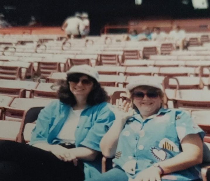 <strong>Watching baseball</strong>: One of their favorite haunts was Dodger Stadium in Los Angeles. Here are the two friends at a game in the 1980s. "We loved those Dodger games -- but more important, we loved those Dodger dogs," says Debbie, referring to the hot dogs on sale in the stadium.