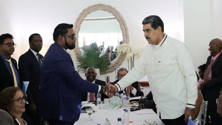 Venezuela's President Nicolas Maduro and Guyanese President Irfaan Ali shake hands as they meet amid tensions over a border dispute, in Kingstown, St. Vincent and the Grenadines December 14, 2023.