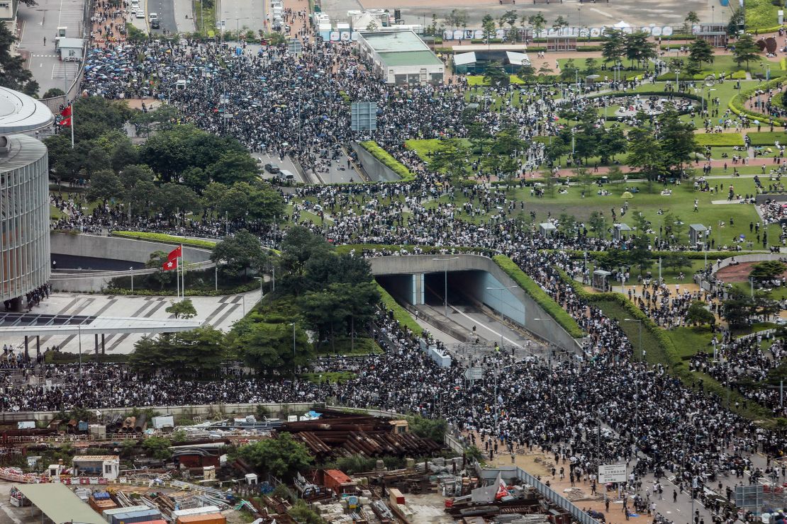 Protesters block roads during a rally against a controversial extradition law proposal outside the government headquarters in Hong Kong on June 12, 2019