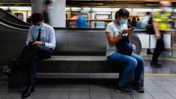 People use mobile phones in Taipei City, Taiwan, 27 July 2020. 