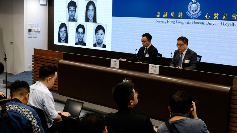 Chief Superintendent of Police (National Security Department ) Li Kwai-wah and Senior Superintendent Hung Ngan attend a press conference to issue arrest warrants for five activists Simon Cheng, Frances Hui, Joey Siu, Johnny Fok and Tony Choi, in Hong Kong, China December 14, 2023.