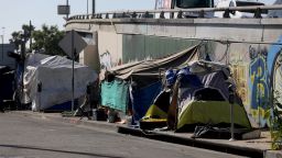 A homeless encampment blocks the sidewalk along 18th Street and Grand next to the 10 FWY east in downtown on Thursday, July 6, 2023 in Los Angeles, CA.
