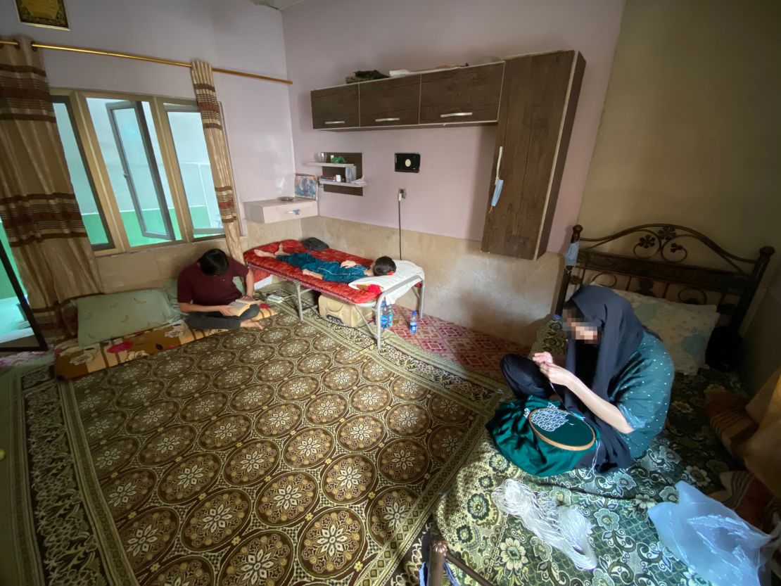 The siblings live in fear of being forcibly returned to Afghanistan and life under Taliban rule. A portion of this photo has been blurred by CNN to protect identity.