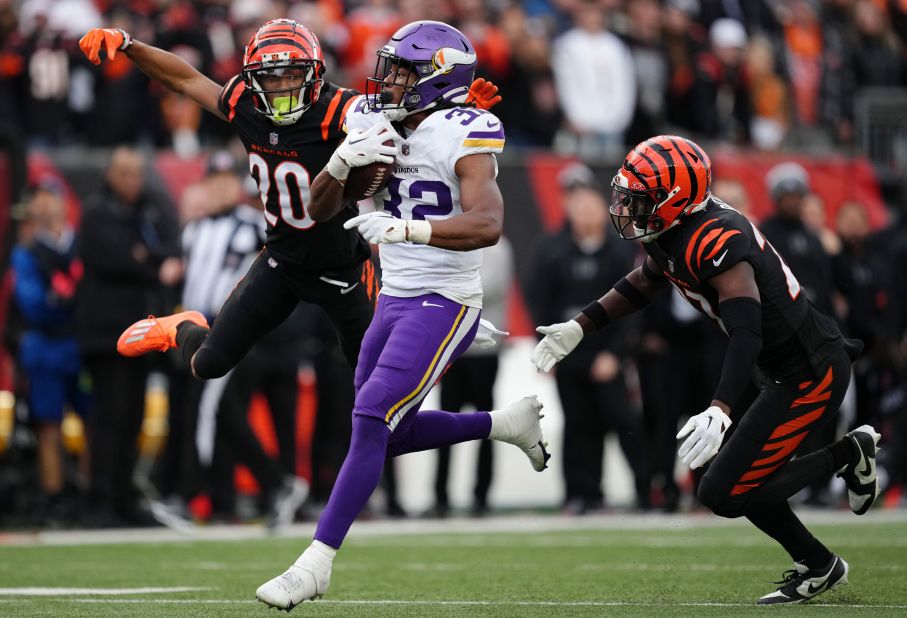 Minnesota Vikings running back Ty Chandler carries the ball. The Vikings lost to the Cincinnati Bengals 27-24 in overtime.
