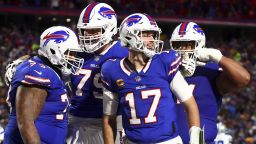 Buffalo Bills quarterback Josh Allen (17) celebrates with teammates after scoring a touchdown against the Dallas Cowboys during the second quarter of an NFL football game, Sunday, Dec. 17, 2023, in Orchard Park, N.Y. (AP Photo/Jeffrey T. Barnes)