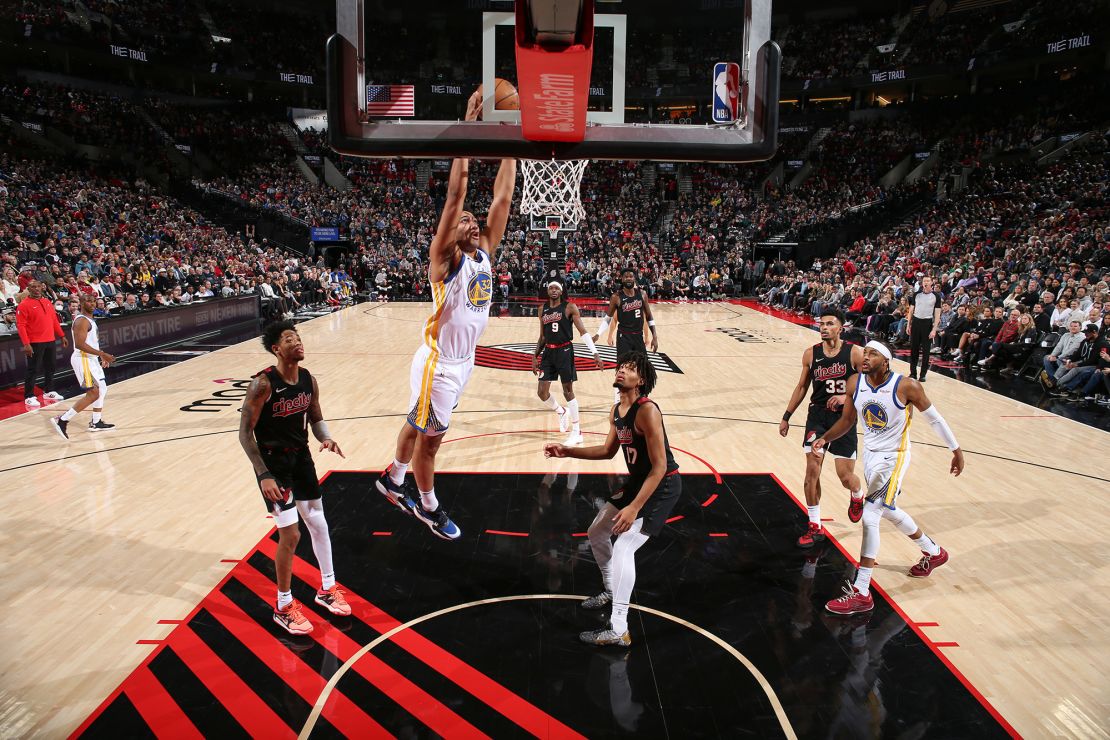 PORTLAND, OR - DECEMBER 17: Trayce Jackson-Davis #32 of the Golden State Warriors goes to the basket during the game on December 17, 2023 at the Moda Center Arena in Portland, Oregon. NOTE TO USER: User expressly acknowledges and agrees that, by downloading and or using this photograph, user is consenting to the terms and conditions of the Getty Images License Agreement. Mandatory Copyright Notice: Copyright 2023 NBAE (Photo by David Sherman/NBAE via Getty Images)
