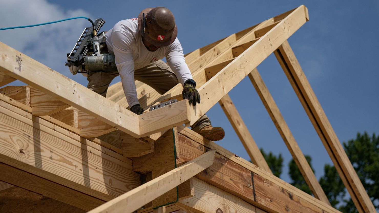 A worker builds a home in Lillington, North Carolina, US, on Thursday, June 15, 2023. The US Census Bureau is scheduled to release housing starts figures on June 20. Photographer: Allison Joyce/Bloomberg via Getty Images