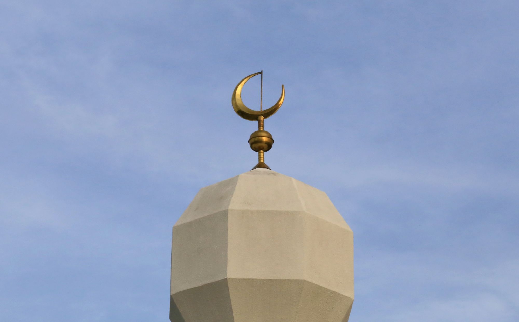 Ornate minaret on top of a mosque.