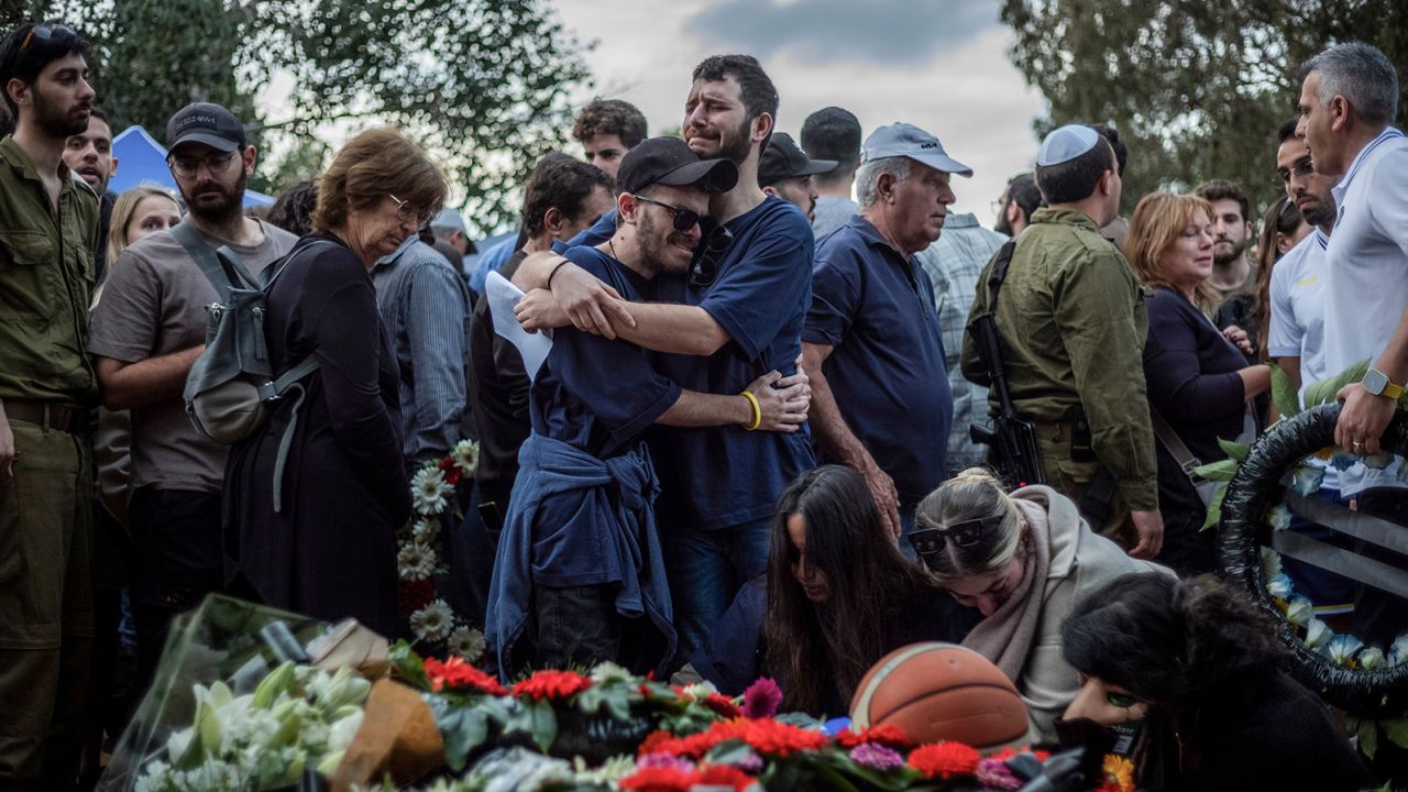 Relatives and friends of Alon Lulu Shamriz, one of the 3 Israeli hostages who were mistakenly killed by friendly fire, mourn during his funeral in Shefayim, Israel on December 17, 2023.