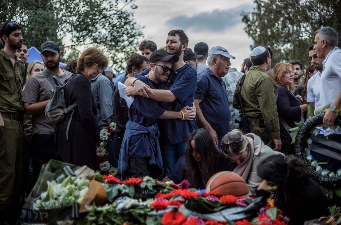 Relatives and friends of Alon Lulu Shamriz, one of the 3 Israeli hostages who were mistakenly killed by friendly fire, mourn during his funeral in Shefayim, Israel on December 17, 2023.
