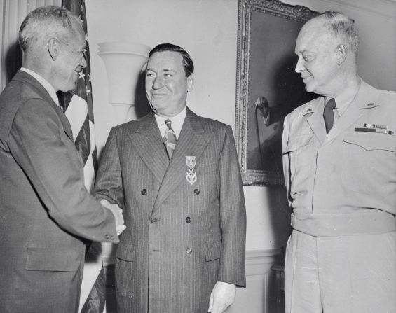 US War Secretary Robert P. Patterson, left, congratulates US Steel President Benjamin Fairless after he was awarded the Medal of Merit in 1946. At right is Gen. Dwight D. Eisenhower, who would later become president.