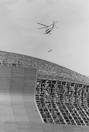 A helicopter lifts a panel of steel over the Louisiana Superdome that was being built in New Orleans in 1973.