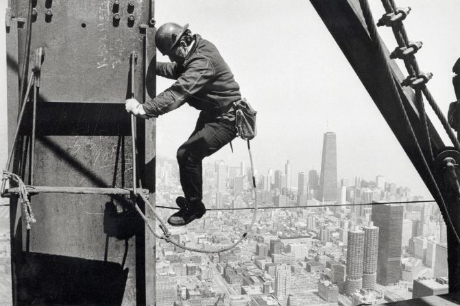 A worker helps construct the top floors of the Sears Tower building in Chicago in 1973.
