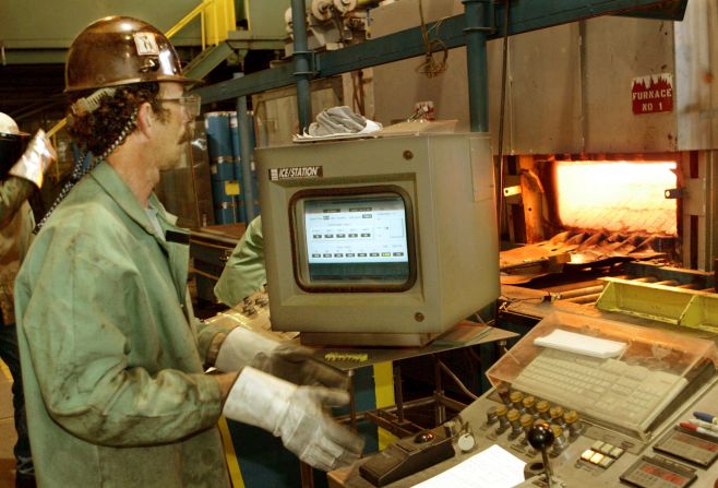 Bob Simmons monitors controls for a furnace and rolling machine at a US Steel research and development facility in Monroeville, Pennsylvania, in 2005.