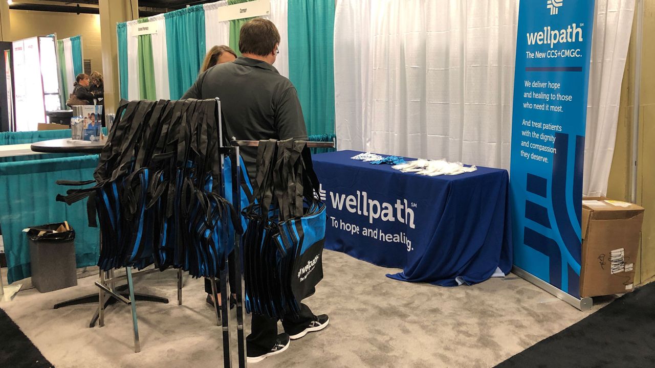 A Wellpath display is pictured at a conference organized by the National Commission on Correctional Health Care in Nashville, Tennessee, U.S., April 9, 2019. Picture taken April 9, 2019.   To match Special Report USA-JAILS/PRIVATIZATION  REUTERS/Peter Eisler