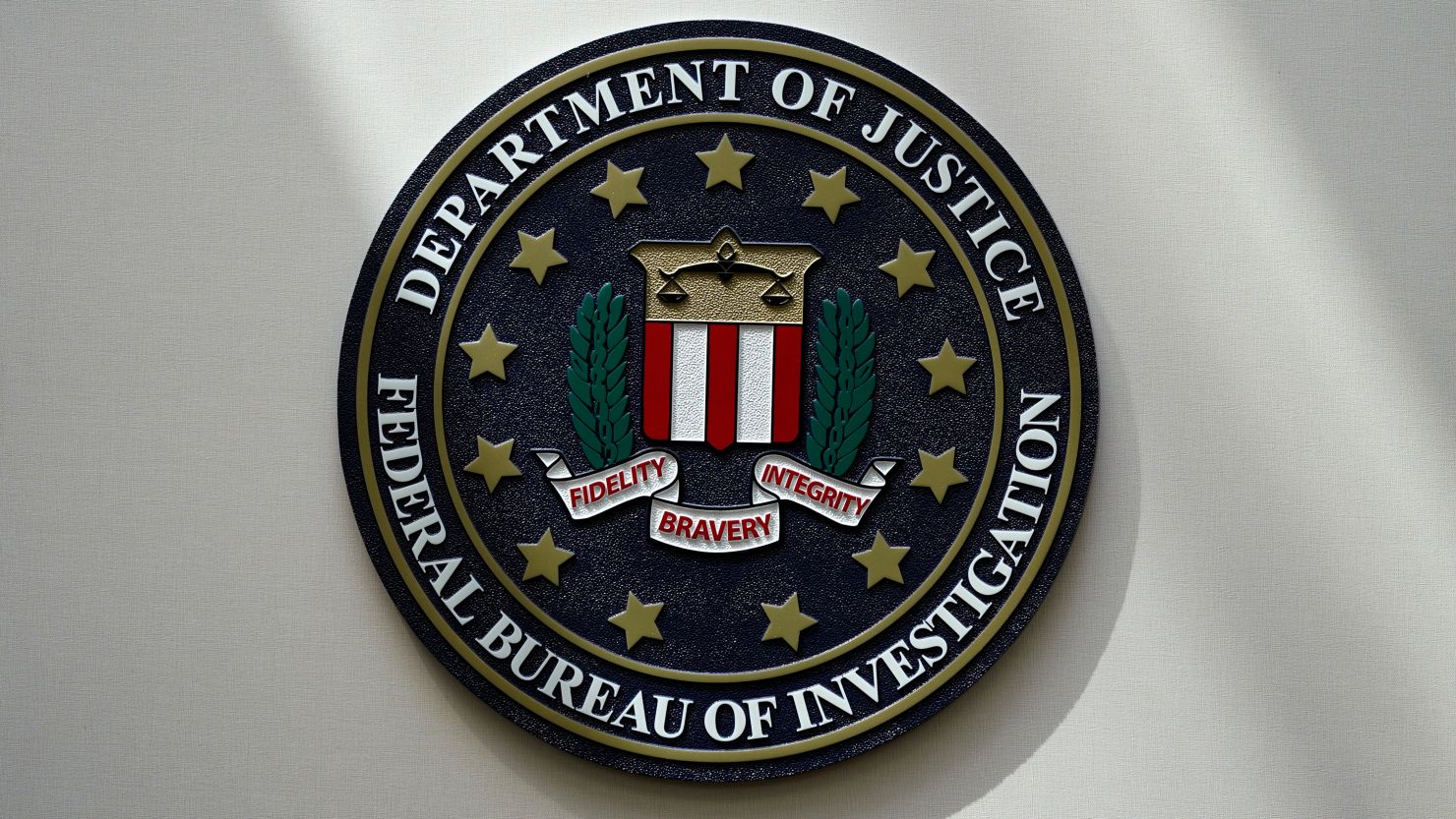 FILE - An FBI seal is seen on a wall on Aug. 10, 2022, in Omaha, Neb. A former American diplomat who served as U.S. ambassador to Bolivia has been arrested in a long-running FBI counterintelligence investigation, accused of secretly serving as an agent of Cuba's government, The Associated Press has learned. (AP Photo/Charlie Neibergall, File)