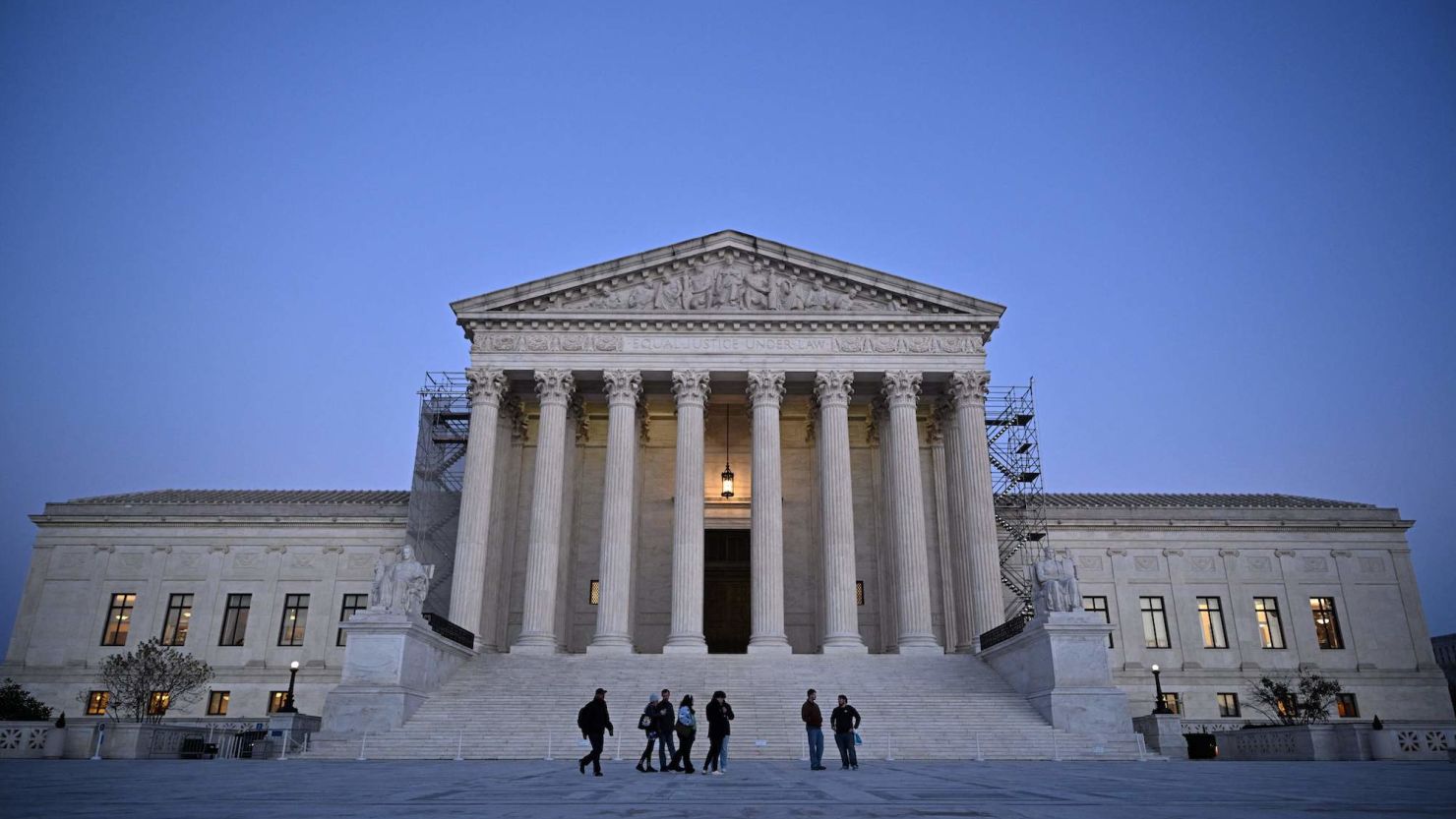 People walk past the US Supreme Court in Washington, DC on November 13, 2023. The US Supreme Court unveiled an ethics code following a series of scandals over lavish gifts and luxury vacations received by some of its justices. The nine members of the nation's highest court are the only federal judges not explicitly subject to ethical oversight, and pressure has been mounting from Democrats in the Senate for them to adopt a code of conduct. (Photo by Mandel NGAN / AFP) (Photo by MANDEL NGAN/AFP via Getty Images)