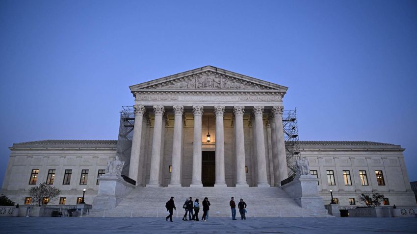 People walk past the US Supreme Court in Washington, DC on November 13, 2023. The US Supreme Court unveiled an ethics code following a series of scandals over lavish gifts and luxury vacations received by some of its justices. The nine members of the nation's highest court are the only federal judges not explicitly subject to ethical oversight, and pressure has been mounting from Democrats in the Senate for them to adopt a code of conduct. (Photo by Mandel NGAN / AFP) (Photo by MANDEL NGAN/AFP via Getty Images)