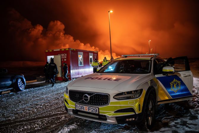 A police vehicle is parked at the entrance of the road to Grindavík.