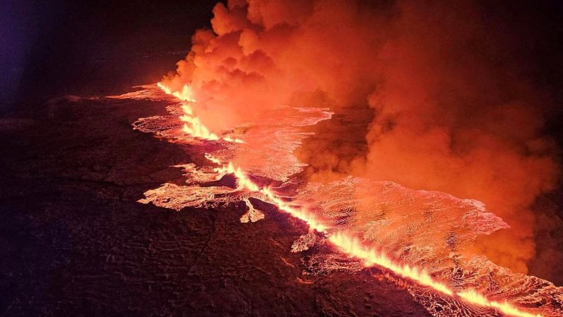 A volcano spews lava and smoke as it erupts in Grindavik, Iceland, on Monday, December 18.