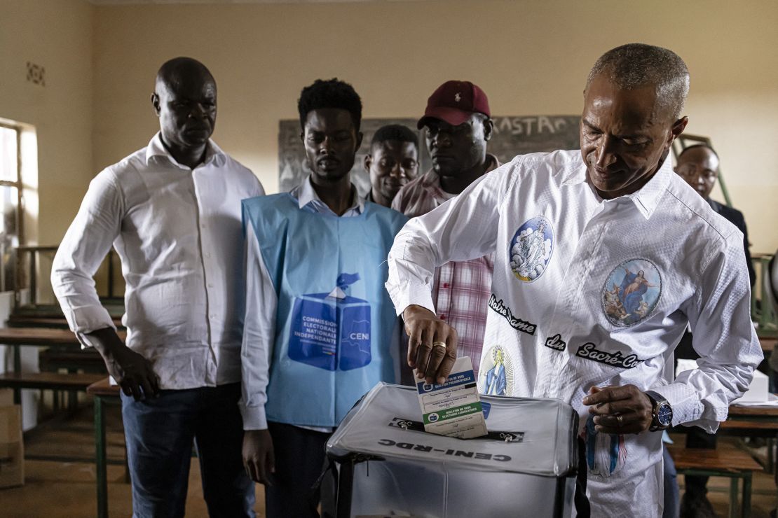 Congolese presidential candidate Moise Katumbi (R) casts his ballot at the Bwakya School polling station in Lubumbashi on December 20, 2023. Millions of Congolese head to the polls on December 20, 2023 in a high-stakes presidential election pitting the incumbent President Felix Tshisekedi against a fragmented opposition. (Photo by Patrick Meinhardt / AFP) (Photo by PATRICK MEINHARDT/AFP via Getty Images)